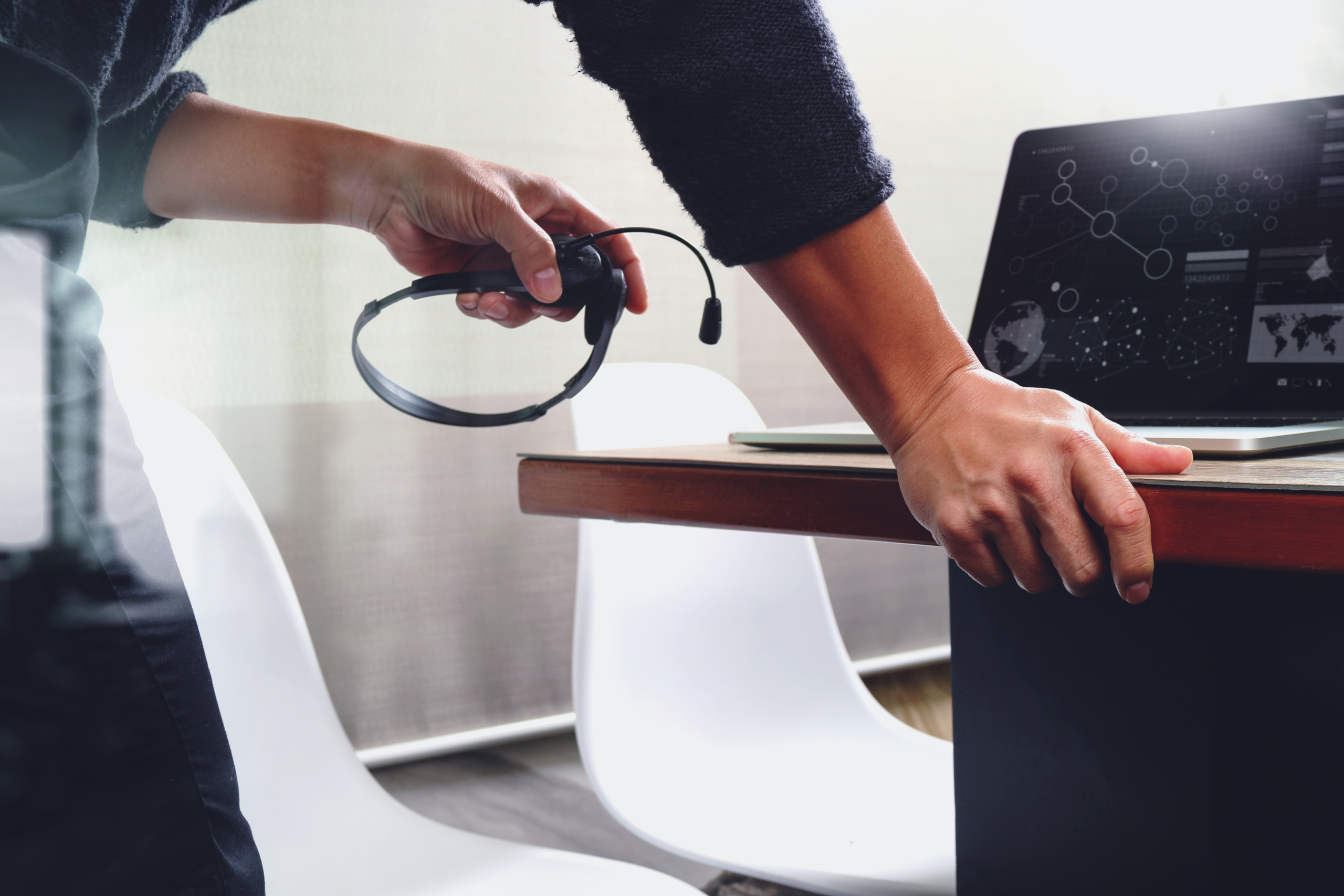 Man,Using,Voip,Headset,With,Digital,Tablet,Computer,Docking,Smart